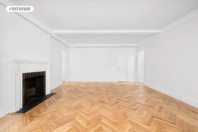 a view of empty room with fireplace