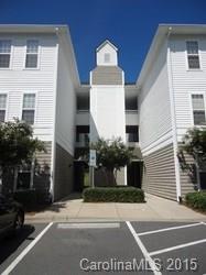 10125 Westmoreland Road, Unit 1B Cornelius, NC 28031 - Photo 2 of 15 a view of a brick building next to a yard