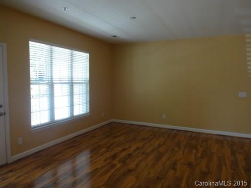 10125 Westmoreland Road, Unit 1B Cornelius, NC 28031 - Photo 5 of 15 an empty room with a window