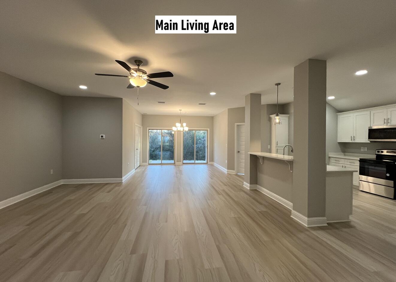 455 Scooter Cove Crestview, FL 32539 - Photo 4 of 15 a view of an empty room with kitchen view and a window