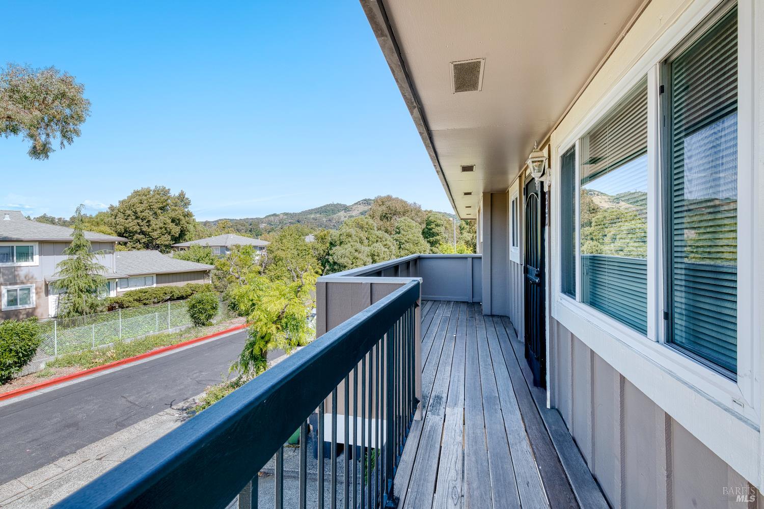 247 Bahia Place San Rafael, CA 94901 - Photo 3 of 22 a view of balcony with wooden floor and fence