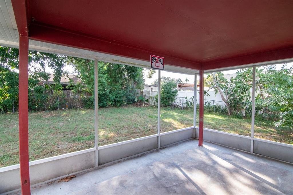 7544 Humboldt Avenue New Port Richey, FL 34655 - Photo 19 of 24 a view of a room with porch and a backyard