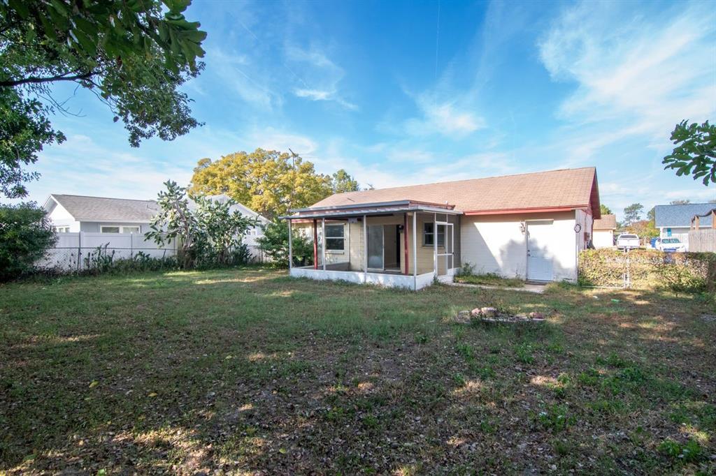 7544 Humboldt Avenue New Port Richey, FL 34655 - Photo 24 of 24 a view of a house with yard and a garden