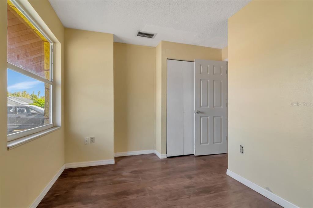 7544 Humboldt Avenue New Port Richey, FL 34655 - Photo 4 of 24 a view of an empty room with window and closet