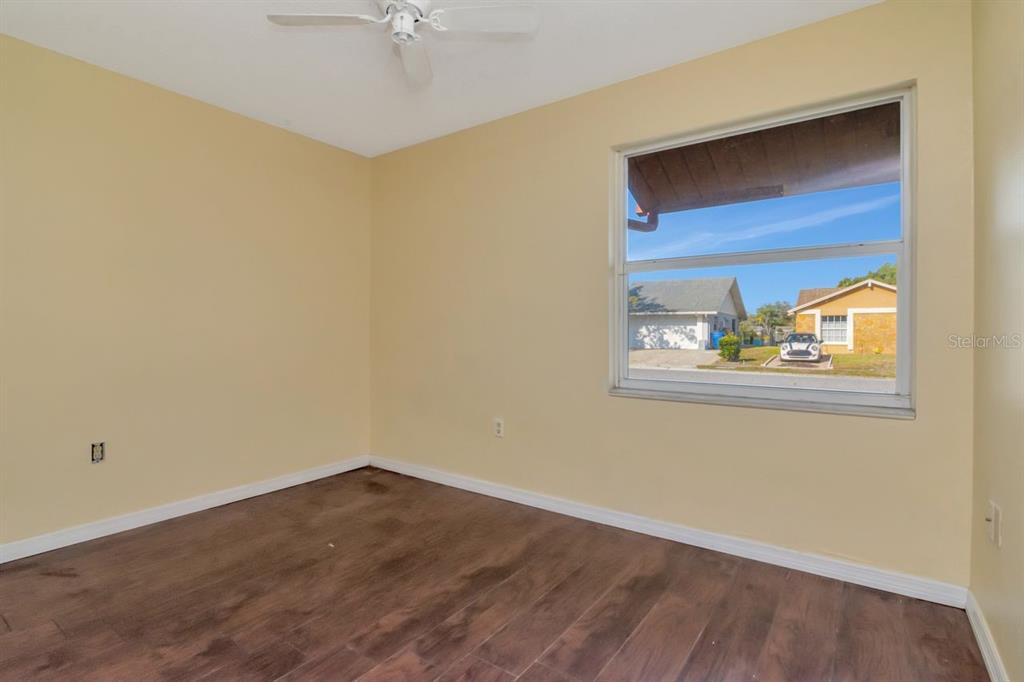 7544 Humboldt Avenue New Port Richey, FL 34655 - Photo 5 of 24 a view of an empty room with a window