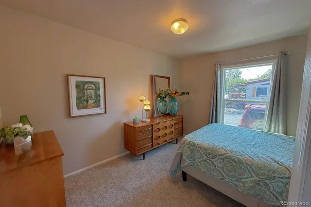 a bedroom with a bed and a couch