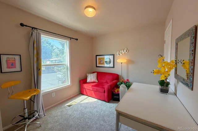 a living room with furniture and a window