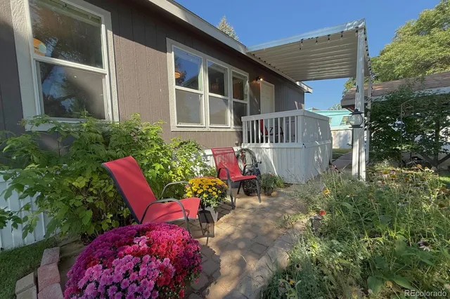 a view of a house with chair and garden