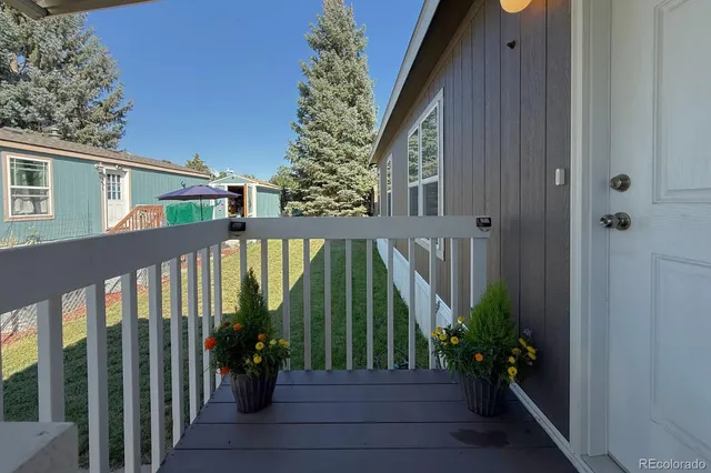 a view of balcony with potted plants