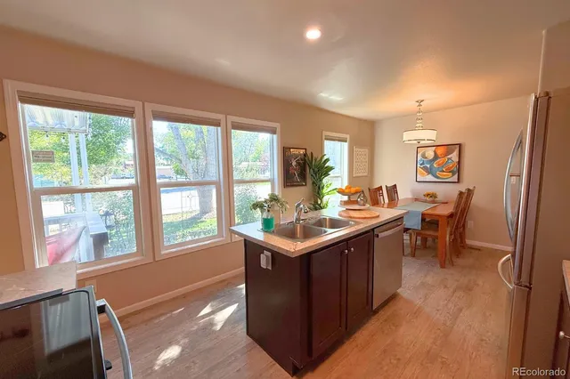 a room with lots of counter top space and painting on the wall