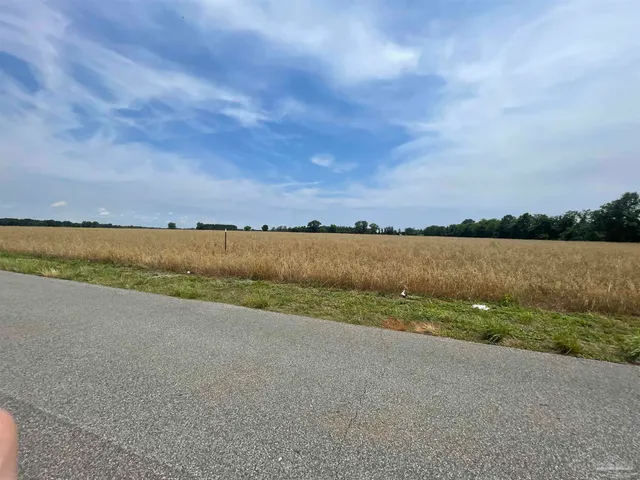 a view of a lake with houses in the back