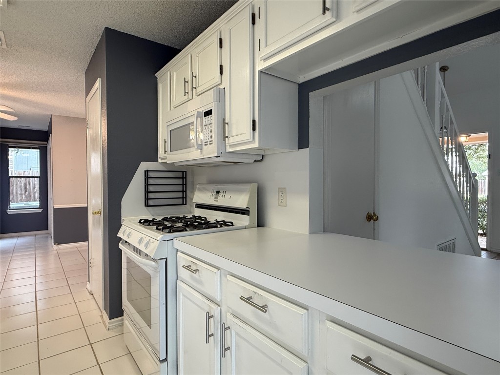 2503 Autrey Drive Leander, TX 78641 - Photo 16 of 39 a kitchen with cabinets and appliances