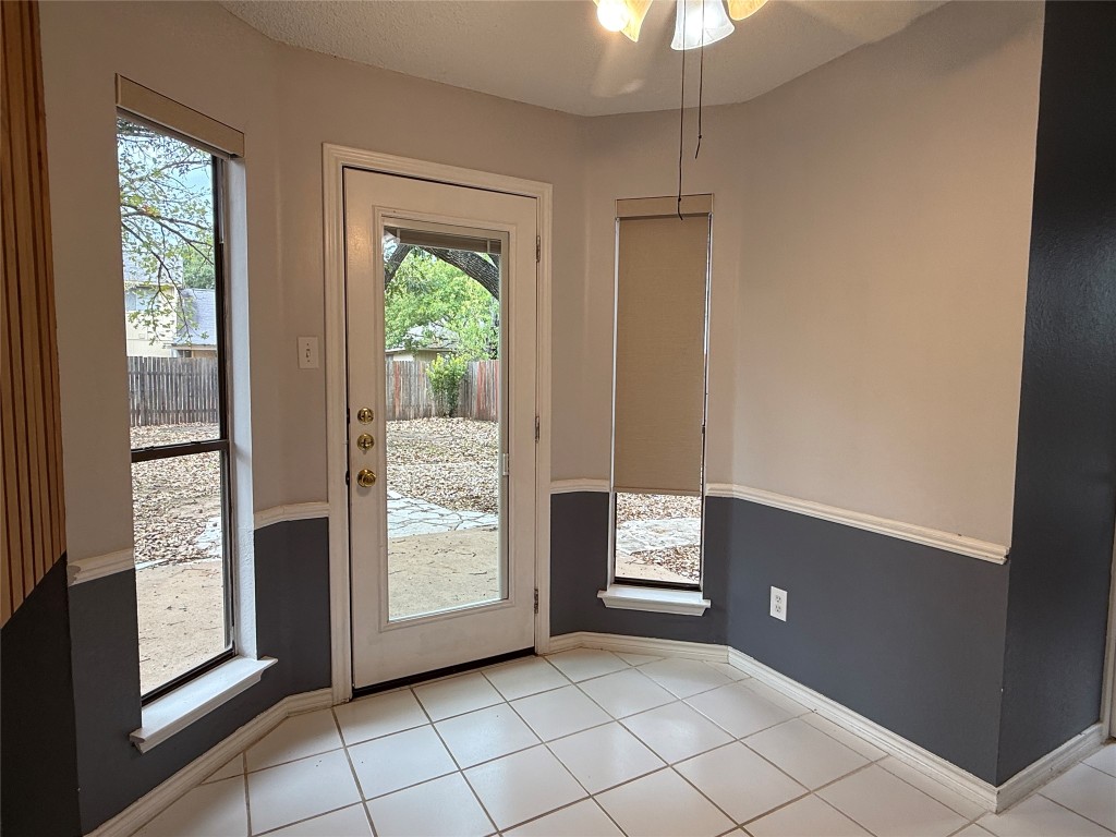 2503 Autrey Drive Leander, TX 78641 - Photo 18 of 39 a view of an empty room with window and cabinet area