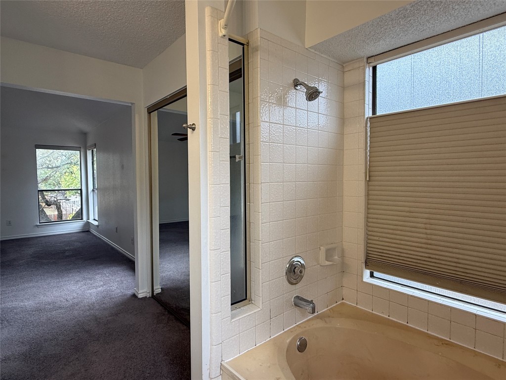 2503 Autrey Drive Leander, TX 78641 - Photo 28 of 39 a bathroom with a tub and a shower