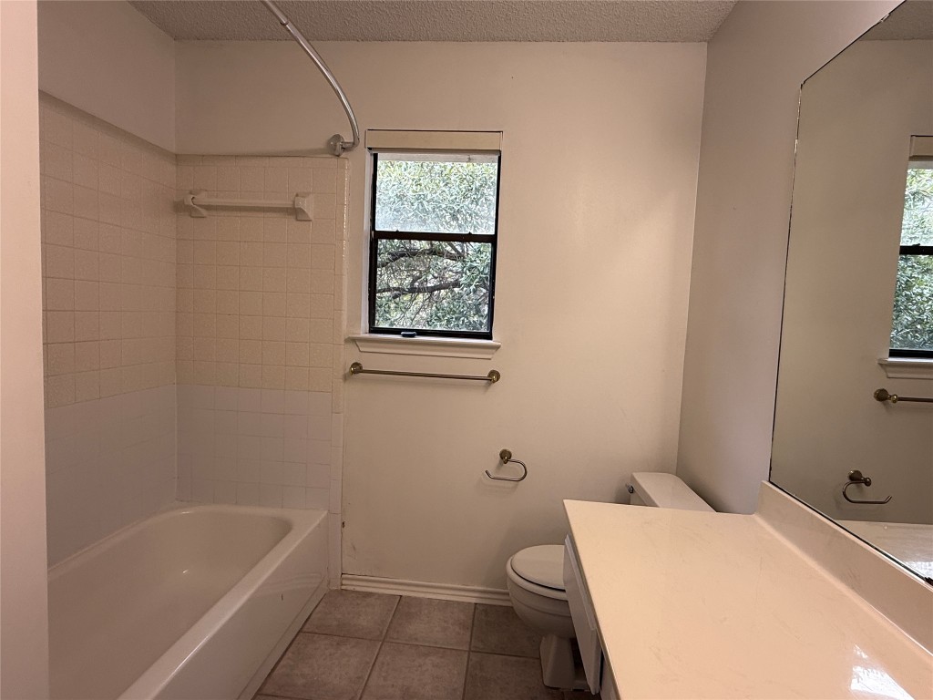 2503 Autrey Drive Leander, TX 78641 - Photo 34 of 39 a bathroom with a sink a toilet and bathtub
