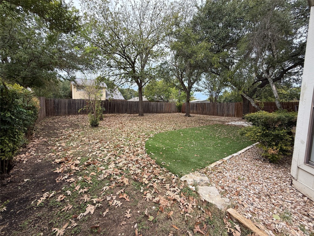 2503 Autrey Drive Leander, TX 78641 - Photo 38 of 39 a view of a backyard with a large tree