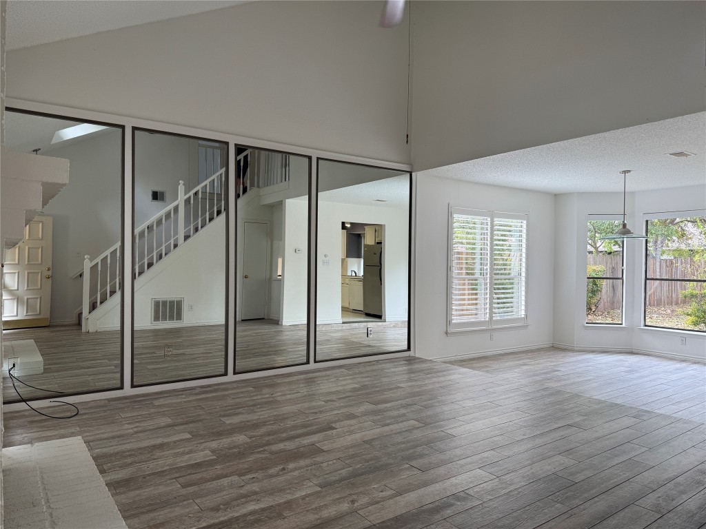 2503 Autrey Drive Leander, TX 78641 - Photo 4 of 39 a view of an empty room with wooden floor and a window