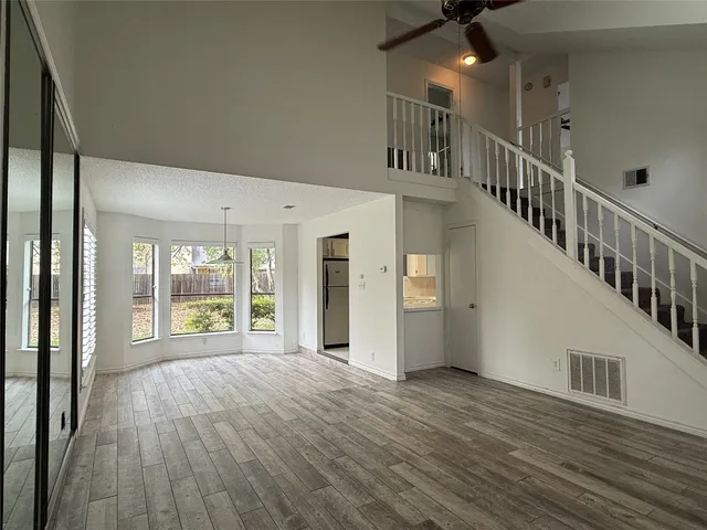 a view of an entryway with wooden floor