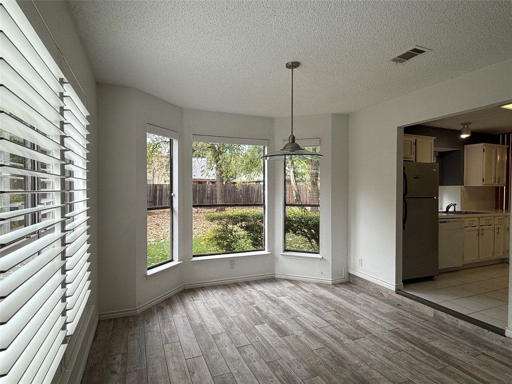 2503 Autrey Drive Leander, TX 78641 - Photo 9 of 39 a view of empty room with window and wooden floor