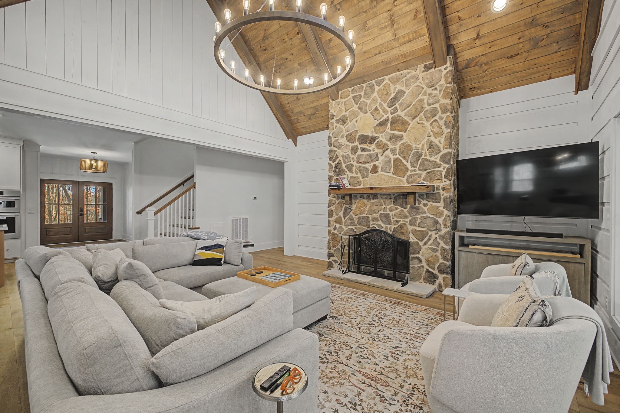 1863 Lake Louisa Loop Monteagle, TN 37356 - Photo 11 of 63 a living room with furniture a flat screen tv and a fireplace