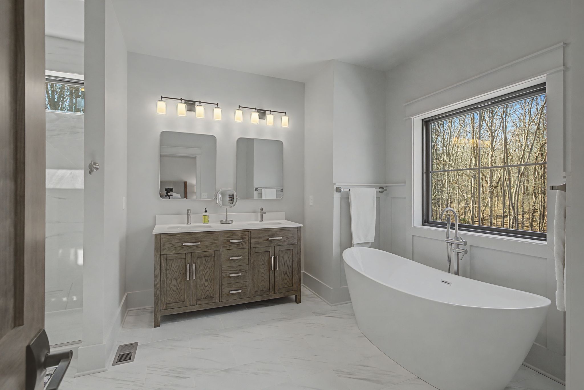 1863 Lake Louisa Loop Monteagle, TN 37356 - Photo 29 of 63 a spacious bathroom with a tub sink and mirror