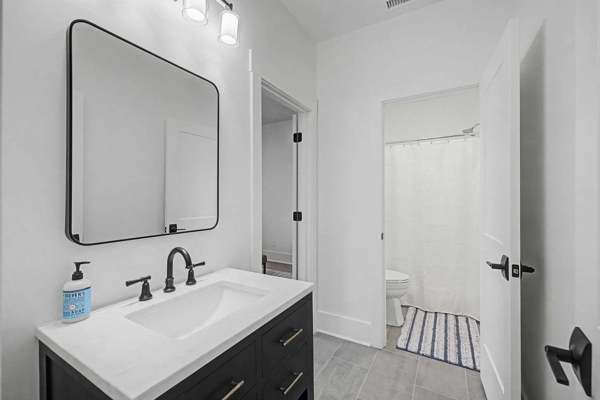 1863 Lake Louisa Loop Monteagle, TN 37356 - Photo 40 of 63 a bathroom with a sink and a mirror
