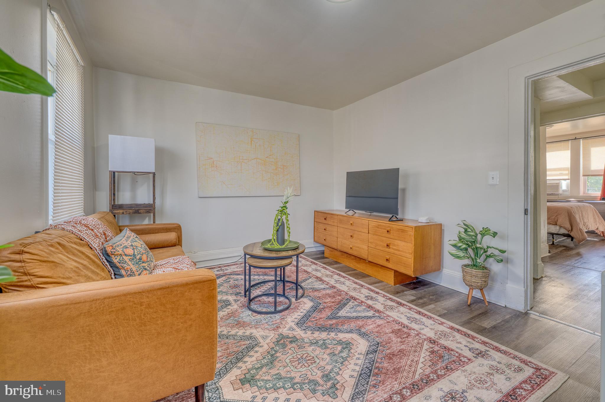 7104 Harford Road Baltimore, MD 21234 - Photo 7 of 37 a living room with furniture and a potted plant