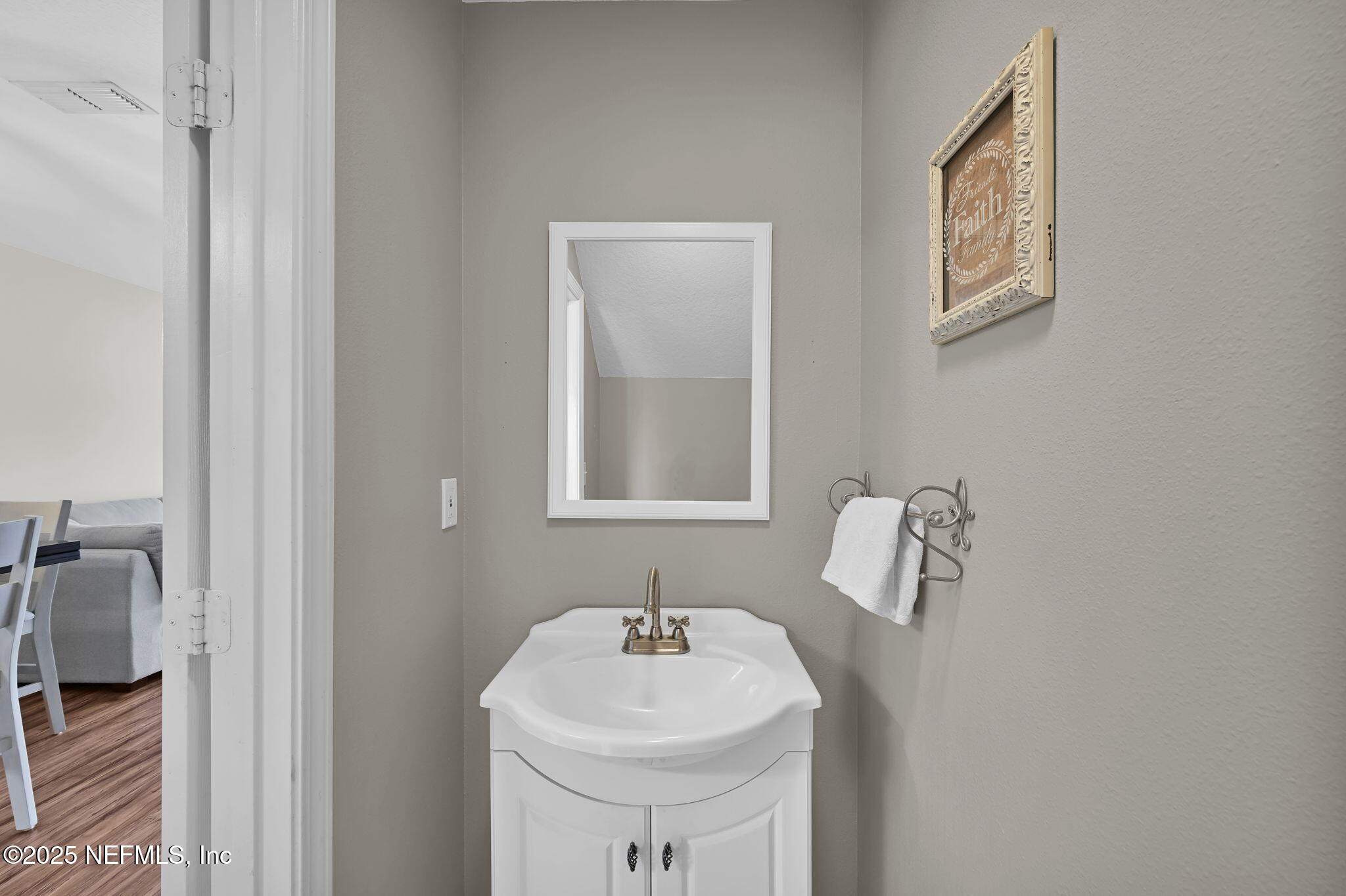 7990 Baymeadows Road East, Unit 2302 Jacksonville, FL 32256 - Photo 13 of 66 a bathroom with a sink and a mirror