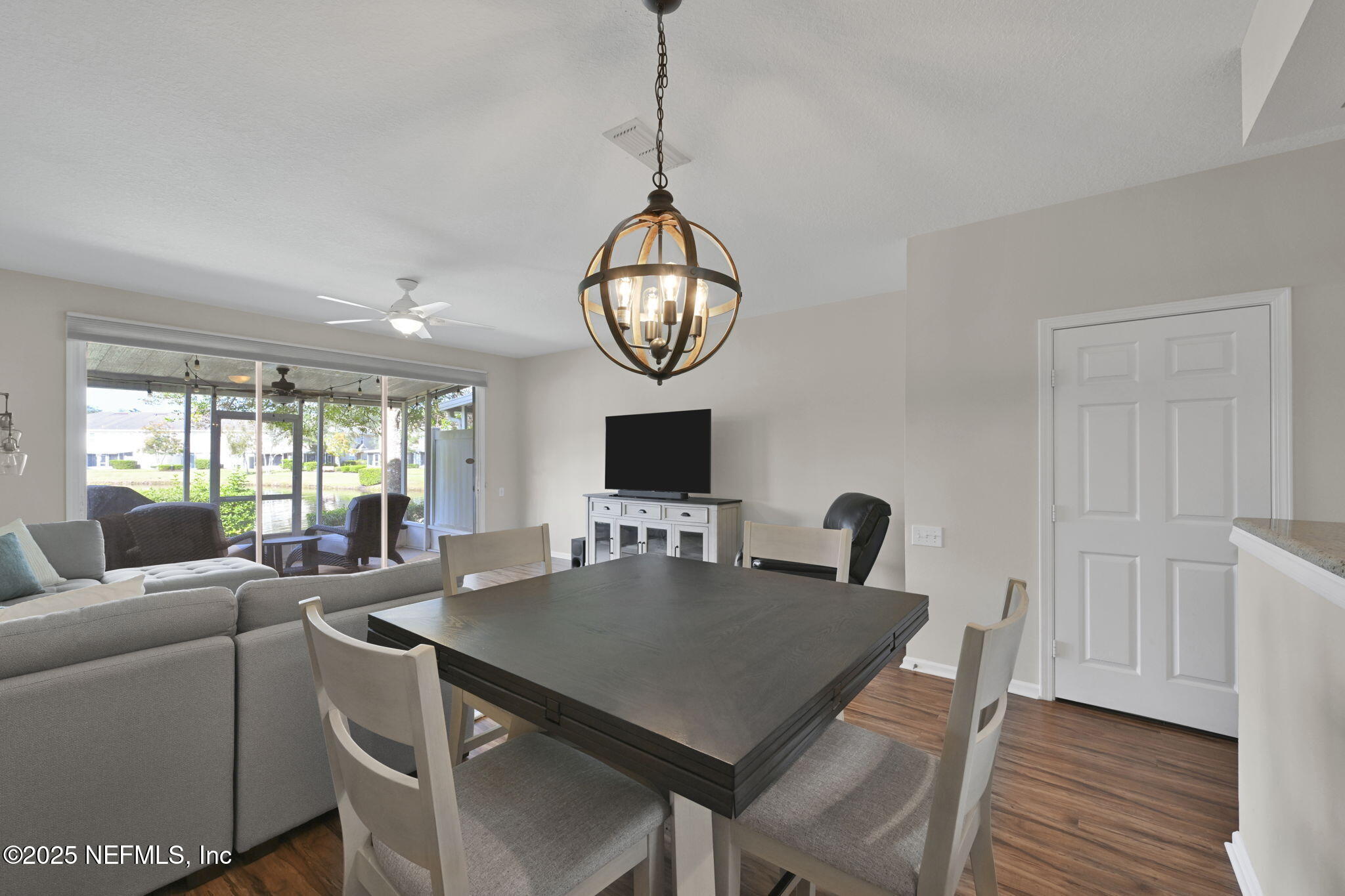 7990 Baymeadows Road East, Unit 2302 Jacksonville, FL 32256 - Photo 17 of 66 a view of a dining room with furniture window and wooden floor