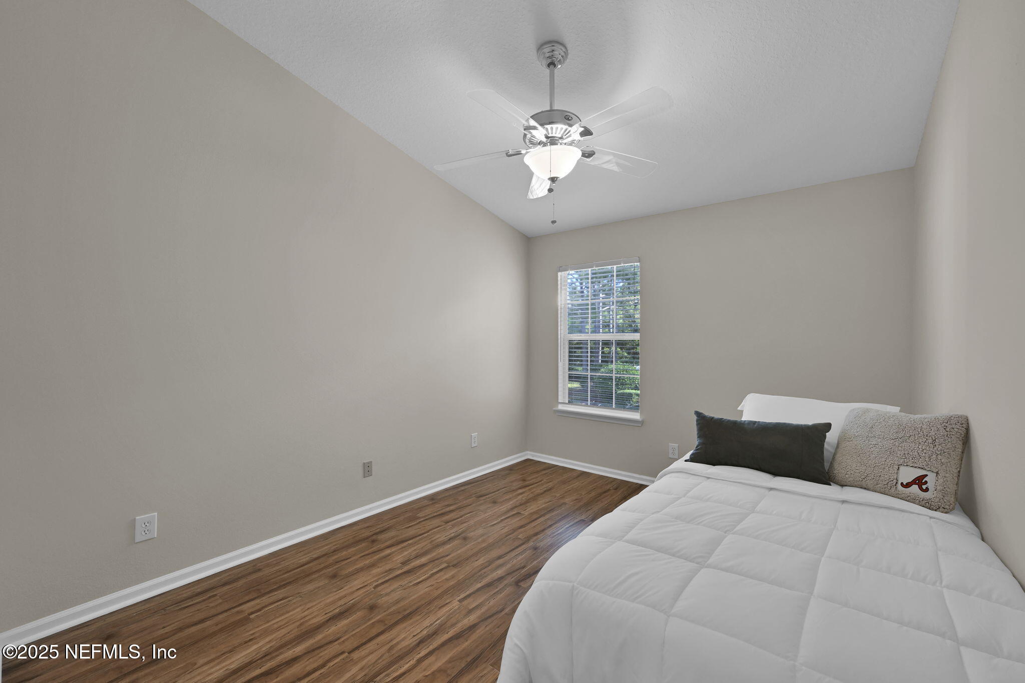 7990 Baymeadows Road East, Unit 2302 Jacksonville, FL 32256 - Photo 23 of 66 a bedroom with a bed and a window