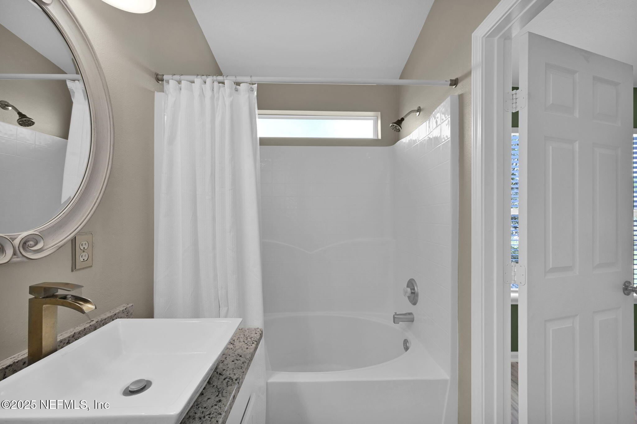 7990 Baymeadows Road East, Unit 2302 Jacksonville, FL 32256 - Photo 32 of 66 a bathroom with a tub and a sink