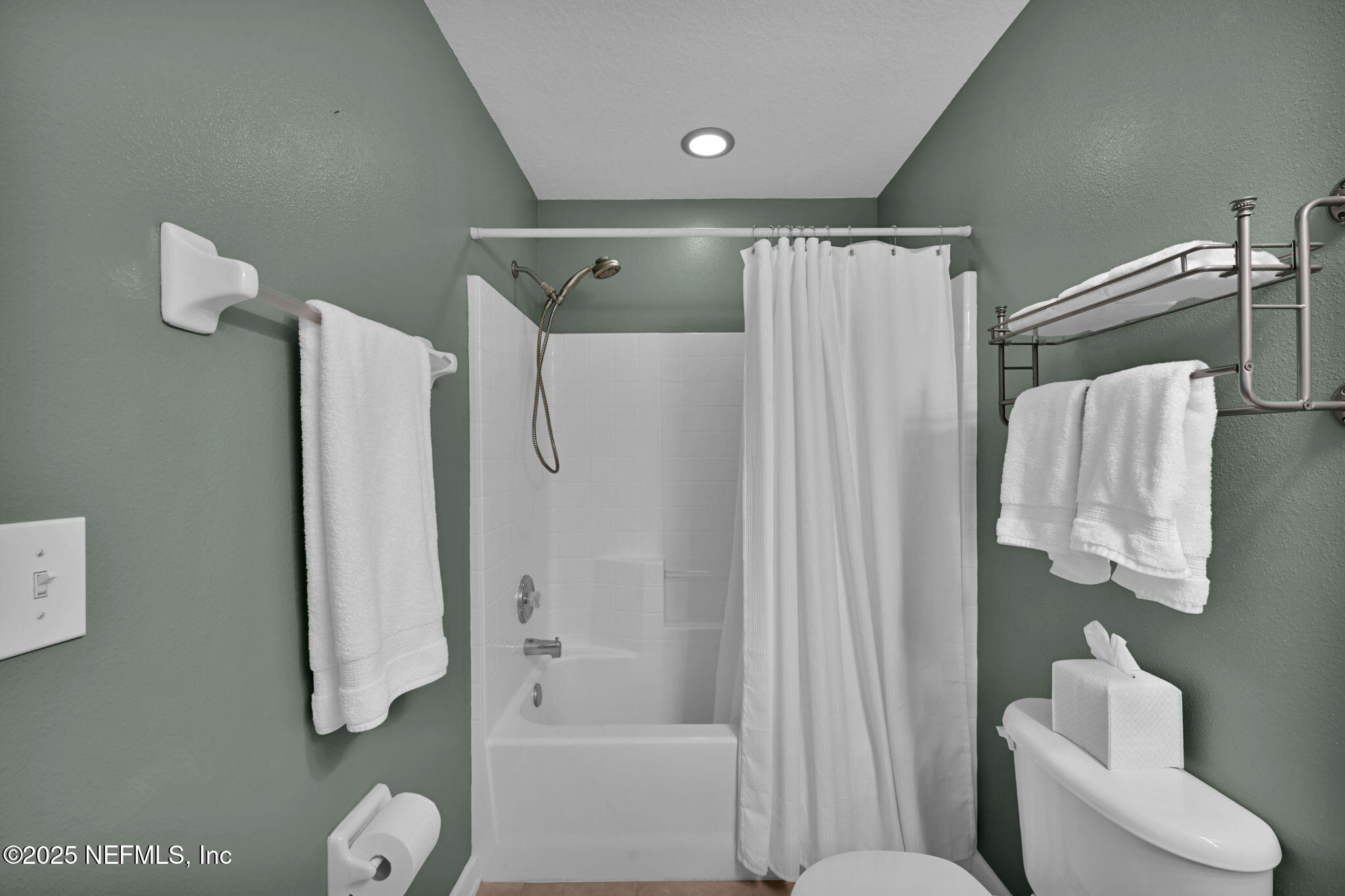 7990 Baymeadows Road East, Unit 2302 Jacksonville, FL 32256 - Photo 38 of 66 a bathroom with a shower curtain and a sink