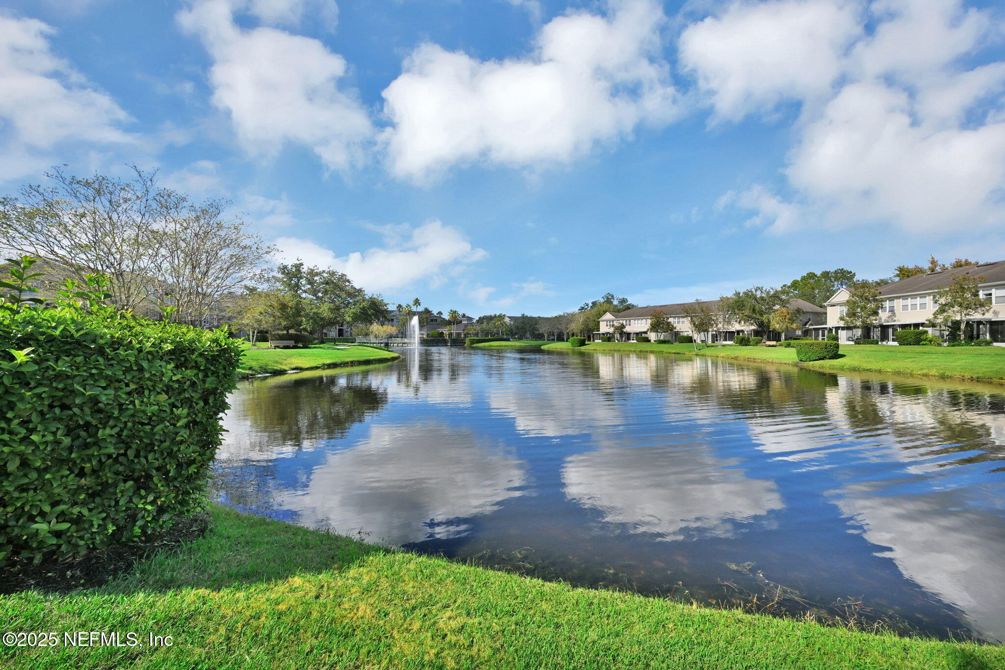 7990 Baymeadows Road East, Unit 2302 Jacksonville, FL 32256 - Photo 42 of 66 a view of a lake with houses in the back