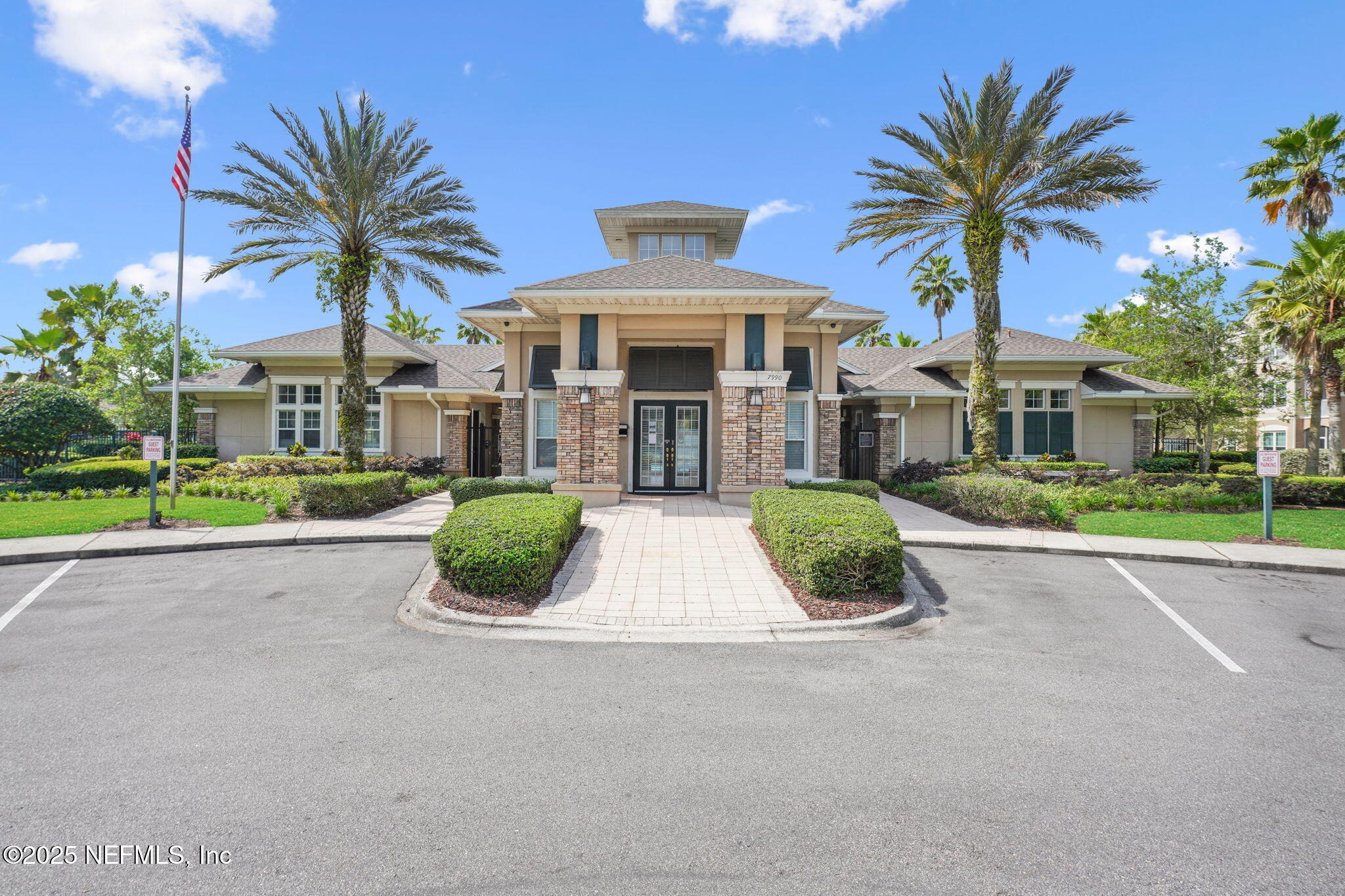 7990 Baymeadows Road East, Unit 2302 Jacksonville, FL 32256 - Photo 45 of 66 a front view of a house with a yard and garage