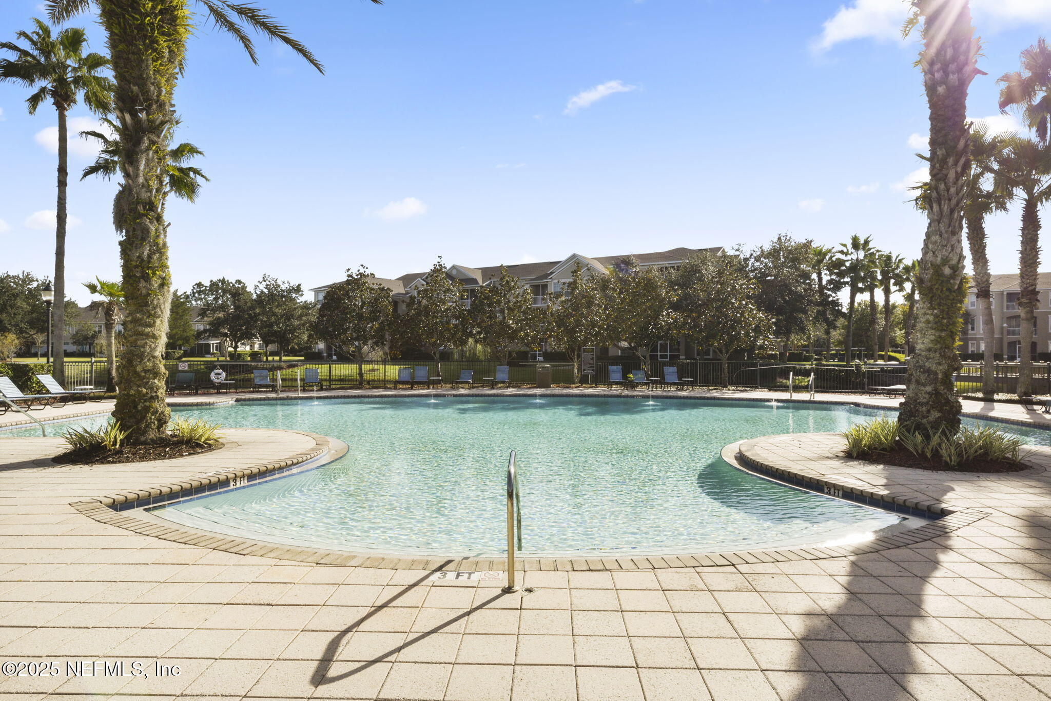 7990 Baymeadows Road East, Unit 2302 Jacksonville, FL 32256 - Photo 48 of 66 a view of a swimming pool and lounge chair
