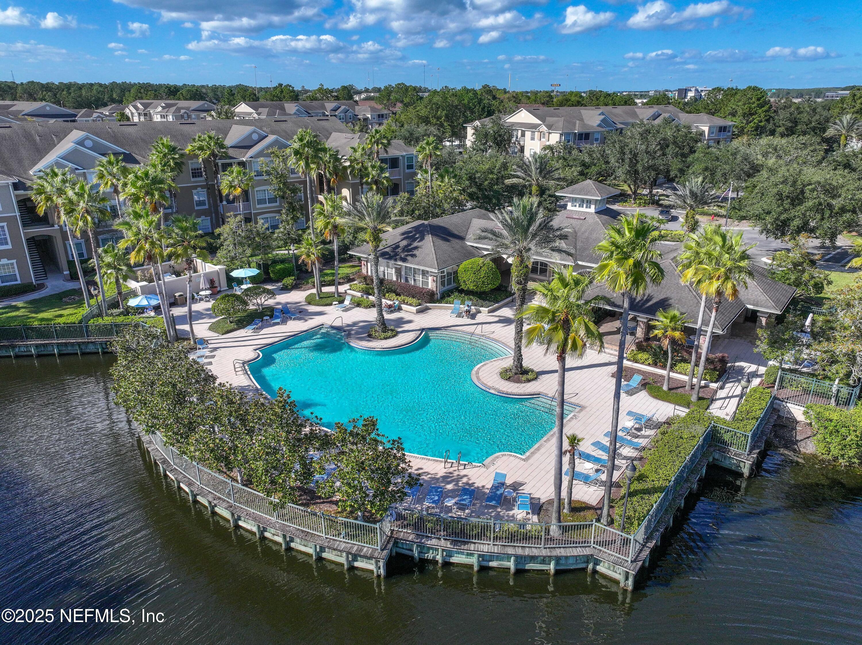 7990 Baymeadows Road East, Unit 2302 Jacksonville, FL 32256 - Photo 59 of 66 a view of a house with a yard and lake view