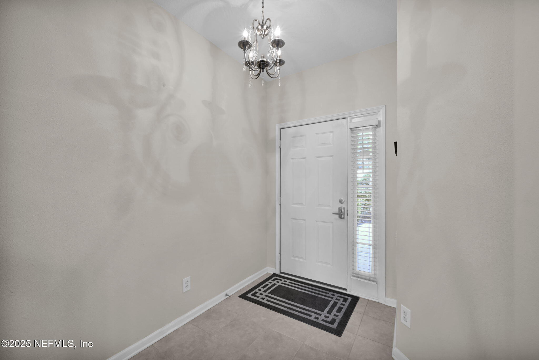 7990 Baymeadows Road East, Unit 2302 Jacksonville, FL 32256 - Photo 6 of 66 a view of a chandelier fan and wooden floor