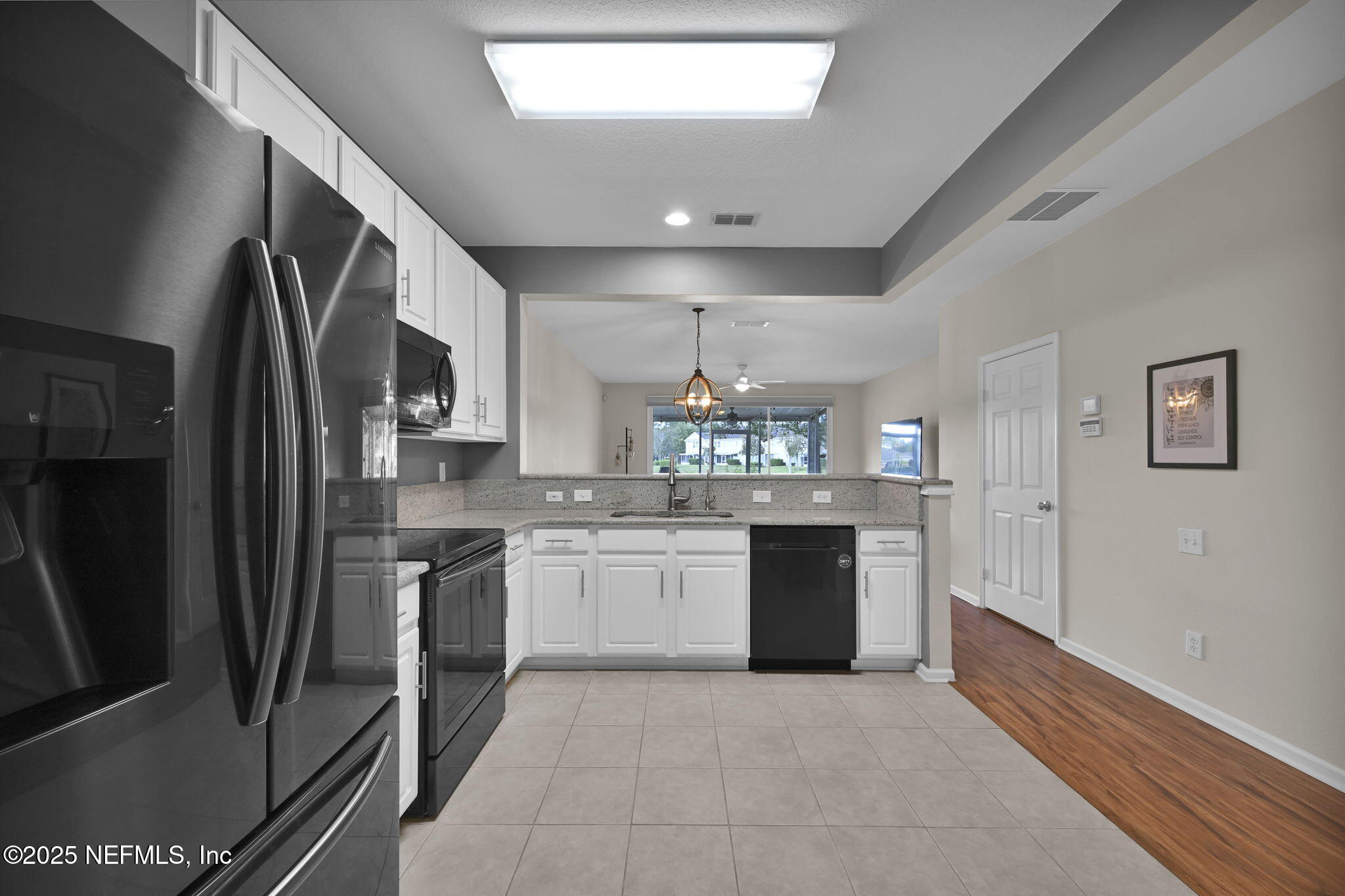 7990 Baymeadows Road East, Unit 2302 Jacksonville, FL 32256 - Photo 10 of 66 a kitchen with stainless steel appliances granite countertop a refrigerator and a stove top oven