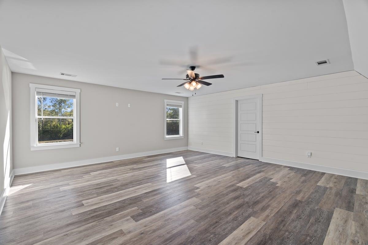 678 Morris Road Covington, TN 38019 - Photo 27 of 40 BR featuring wood finished floors, a ceiling fan, and wooden walls could also double as a Bonus Room