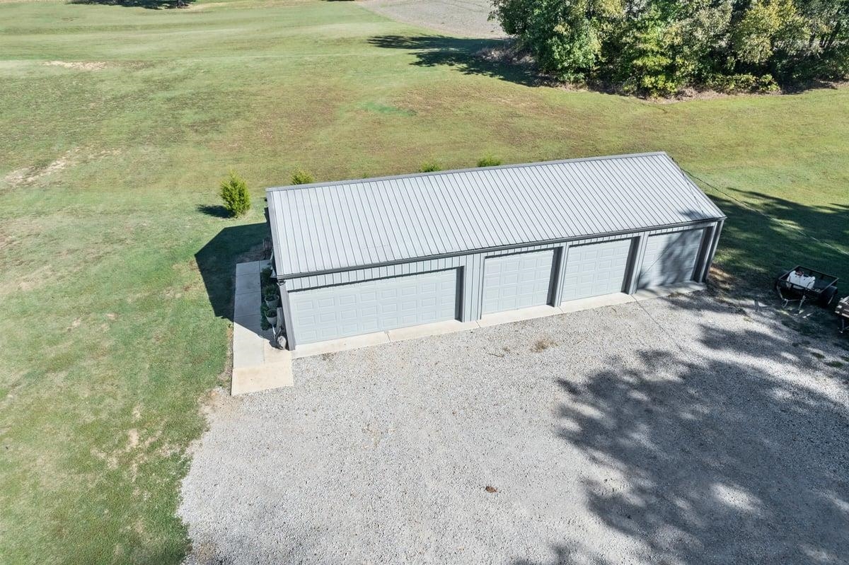 678 Morris Road Covington, TN 38019 - Photo 4 of 40 Bird's eye view of 5 car 24x50 shop. Concrete floor inside