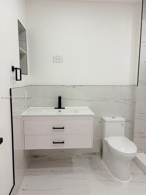 14720 Southwest 107th Terrace Miami, FL 33196 - Photo 11 of 18 a bathroom with a sink toilet and mirror