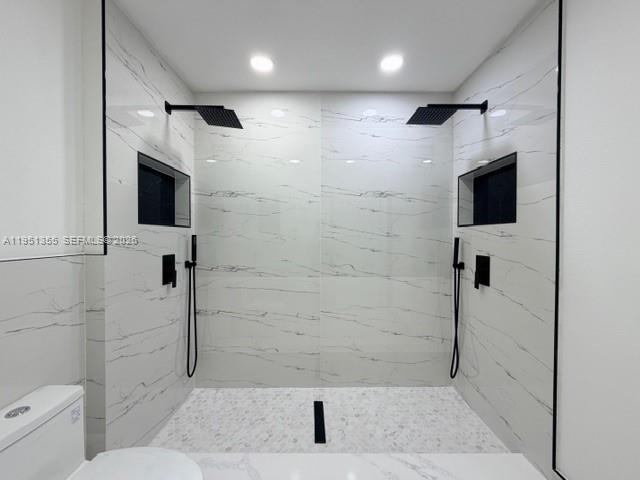 14720 Southwest 107th Terrace Miami, FL 33196 - Photo 12 of 18 a bathroom with a shower a toilet and a mirror