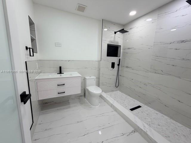 14720 Southwest 107th Terrace Miami, FL 33196 - Photo 13 of 18 a bathroom with a sink a toilet and a shower