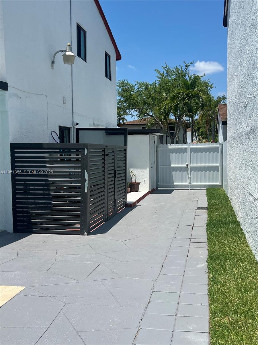 14720 Southwest 107th Terrace Miami, FL 33196 - Photo 17 of 18 a view of house with a yard