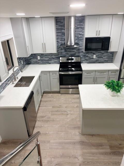 14720 Southwest 107th Terrace Miami, FL 33196 - Photo 4 of 18 a kitchen with a stove a sink and a microwave