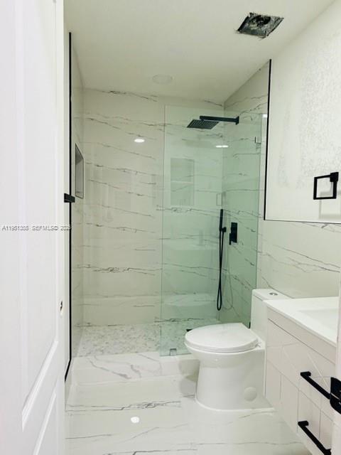 14720 Southwest 107th Terrace Miami, FL 33196 - Photo 5 of 18 a white toilet sitting next to a bathroom sink
