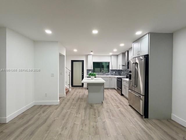 14720 Southwest 107th Terrace Miami, FL 33196 - Photo 7 of 18 a kitchen with stainless steel appliances a refrigerator sink and stove