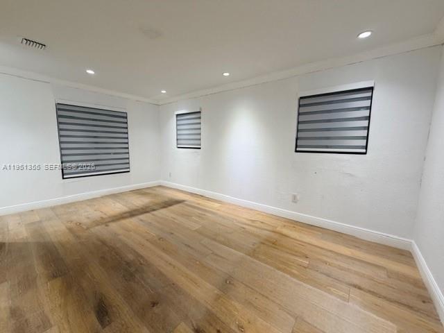 14720 Southwest 107th Terrace Miami, FL 33196 - Photo 9 of 18 a view of an empty room with a window