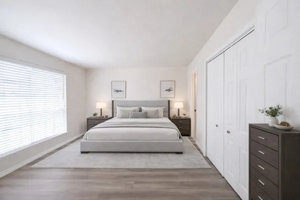 a large white bed in a white room