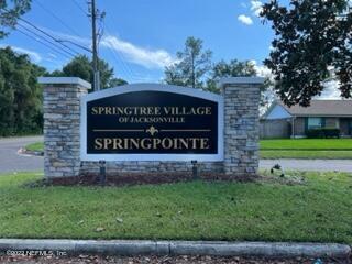 3742 Star Leaf Road West Jacksonville, FL 32210 - Photo 2 of 39 a sign of golf club on a brick wall